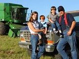 Young family of farmers in field;Farm Family Estate Planning